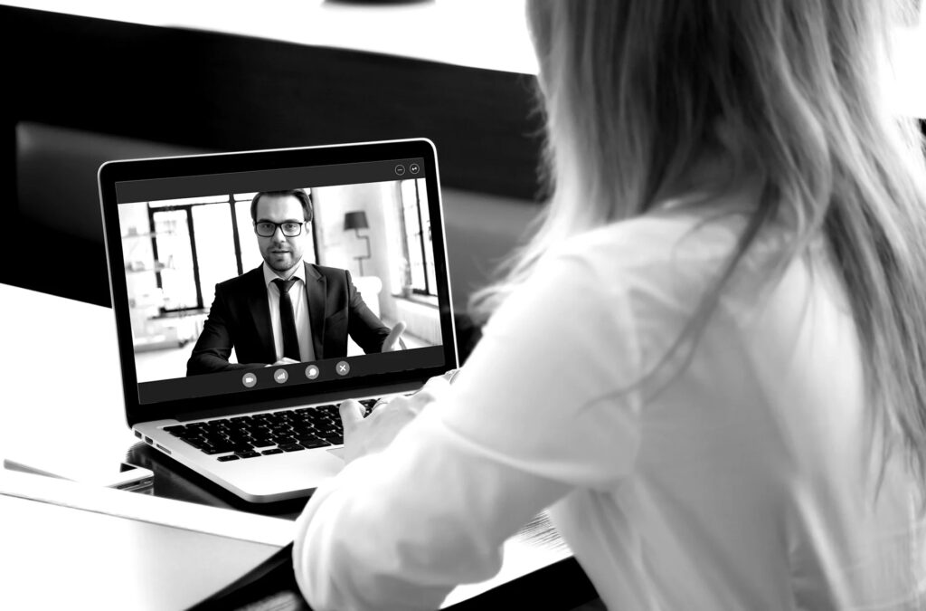 woman video calling a man on a laptop