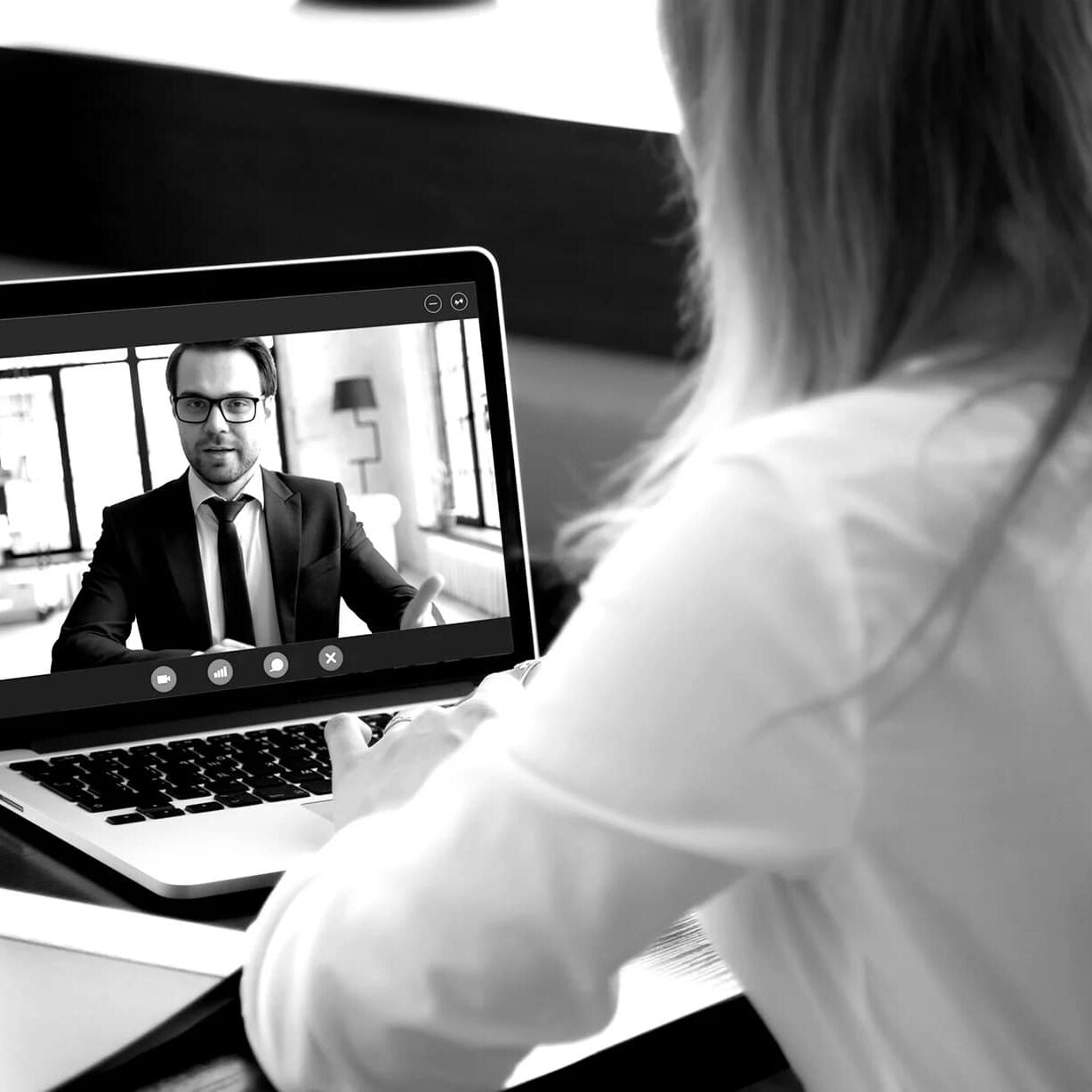 woman video calling a man on a laptop